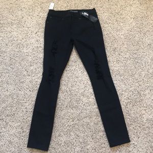 Express mid-rise distressed denim legging. Size 6